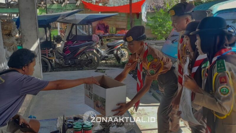Foto : Paragraf siswa pramuka yang melakukan penggalangan dana untuk para korban di Sumatra 